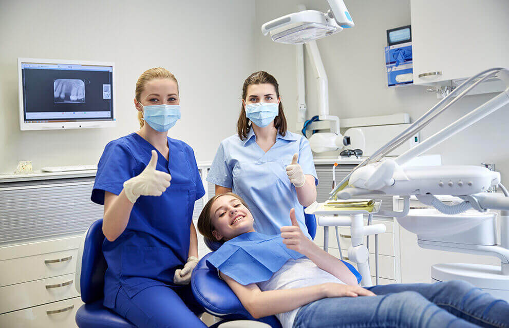 Dentist, assistant, pediatric dental patient